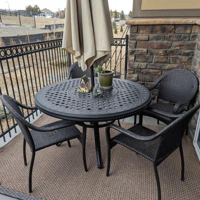 Patio table, 4 chairs and umbrella