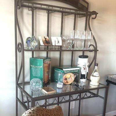 Bakers rack has slate detail at top