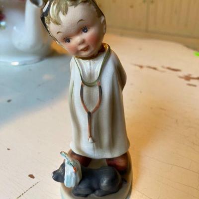 Vintage NAPCO Vet with dog ceramic figurine.
