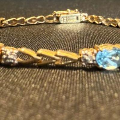 TN63 NAGL Certified 10k White Gold, Blue Topaz, 7' Bracelet	See certificate for more information
