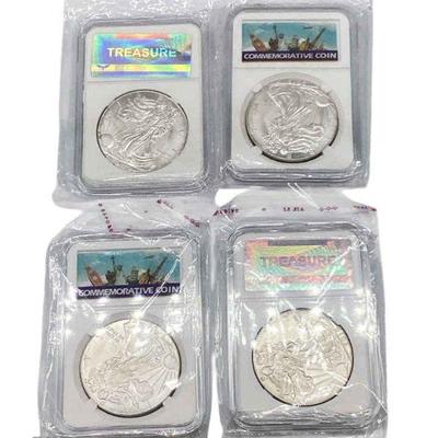 TN03 Silver Eagles In Holders	Four US Mint one ounce Silver Eagles in plastic holders.
