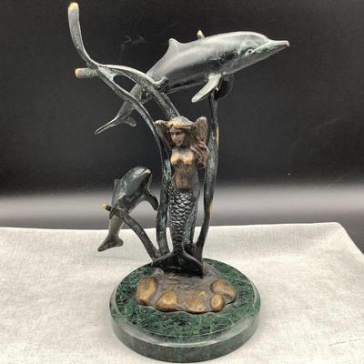 Mermaid and dolphins