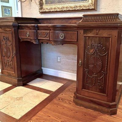 Sideboard with drawer and two locking cabinets.