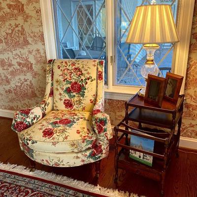 Hickory Chair wing back upholstered chair, 1950s side table with magazine rack, and glass & brass lamp.