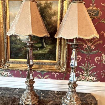 pair of mirrored tall lamps