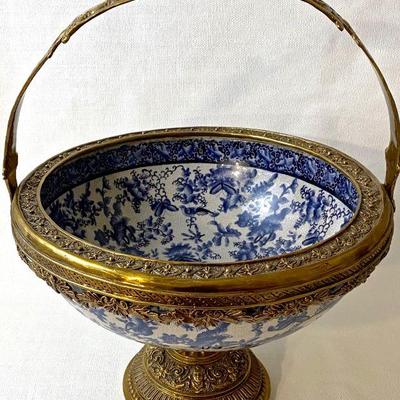 Decorative ceramic and brass footed bowl.