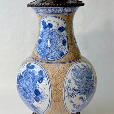 Ceramic and metal decorative urn.