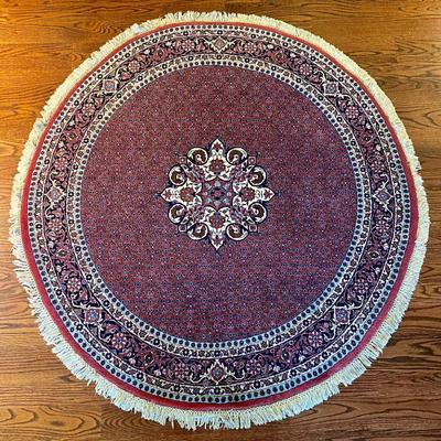 round wool carpet with cotton self-fringe, 61 1/4" diameter