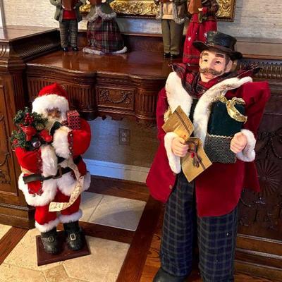 hand-crafted Santa and caroling figures - table top and floor 
model sizes