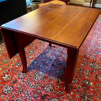 Gat Creek cherry table - 63" x 42" with leaves lifted.