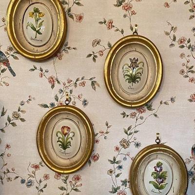 Hand painted flowers on framed ceramic domes.