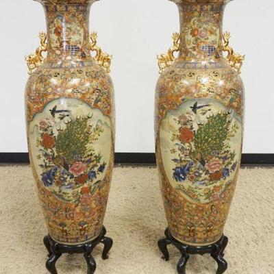 1143	PAIR OF ASIAN FLOOR URNS ON PEDESTALS EACH W/IMAGES OF PEACOCKS & BIRDS W/GILT DRAGONS ON SIDES, APPROXIMATELY 50 IN HIGH

