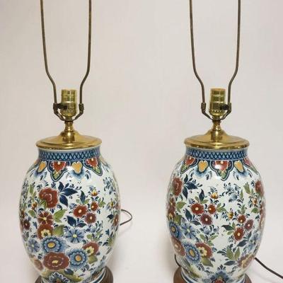 1161	PAIR OF PORCELAIN TABLE LAMPS W/BRASS CAPS ON WOOD BASE W/FLORAL DESIGN ALL OVER, EACH APPROXIMATELY 28 IN HIGH
