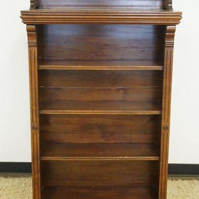1145	WALNUT VICTORIAN BOOKCASE W/REEDED COLUMN SIDES & SCROLLED GALLERY TOP, APPROXIMATELY 34 IN X 12 IN X 55 IN HIGH
