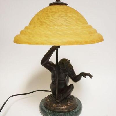 Sale Photo Thumbnail #161: 1162	CONTEMPORARY BRONZE MONKEY LAMP ON MARBLE BASE W/AMBER TORTICE SHELL GLASS SHADE, APPROXIMATELY 19 IN HIGH
