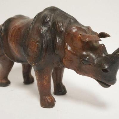 1038	LEATHER RHINOCEROS W/GLASS EYES, APPROXIMATELY 14 IN X 5 IN X 8 1/4 IN HIGH
