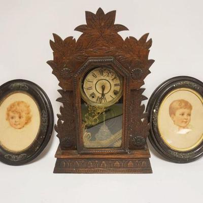 1167	ANTIQUE GILBERT PRESSED WOOD KITCHEN CLOCK & 2 OVAL FRAMES W/IMAGES OF CHILDREN, CLOCK APPROXIMATELY 24 IN HIGH, FACE LOOSE
