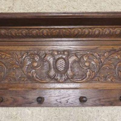 1137	CARVED OAK HANGING COAT RACK SHELF W/LION HEADS & CARVED CENTER CREST, APPROXIMATELY 44 IN X 7 1/2 IN X 15 IN HIGH

