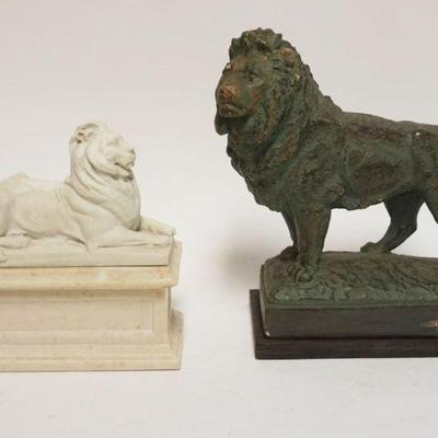 1182	PAIR OF CAST COMPOSITION LIONS ON BASES, LARGEST APPROXIMATELY 4 IN X 7 1/4 IN X 9 IN HIGH

