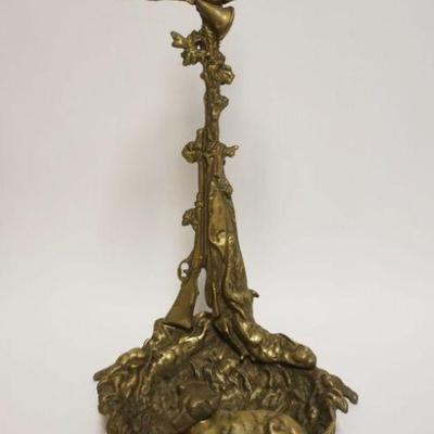 1166	HEAVY ORNATE CAST BRASS FIREPLACE TOOL HOLDER OR UMBRELLA STAND W/EMBOSSED IMAGES OF DOG & FIREARM, APPROXIMATELY 23 IN HIGH
