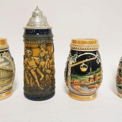 1196	GROUP OF 4 VINTAGE GERMAN STEINS, 2 W/PEWTER TOPS, TALLEST APPROXIMATELY 10 IN HIGH
