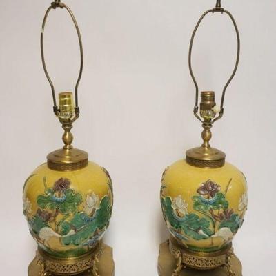 1031	PAIR OF ASIAN POTTERY TABLE LAMPS W/RELIEF IMAGES OF STORKS & FLOWERS, ONE W/HAIRLINE, EACH APPROXIMATELY 29 IN OVERALL
