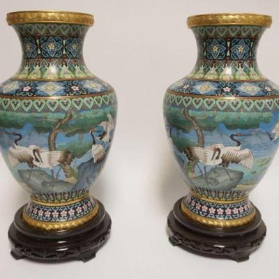 1024	PAIR OF CLOISONNE ENAMELED VASES W/IMAGES OF STORKS ON WOOD BASES, EACH APPROXIMATELY 18 IN OVERALL
