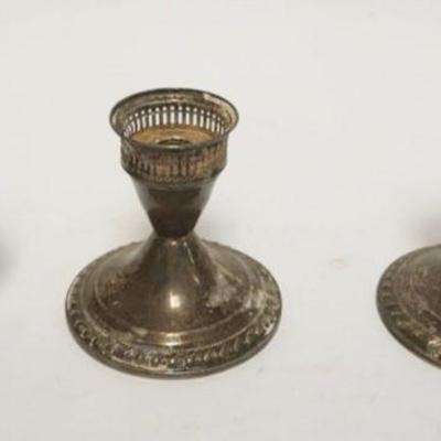 1064	STERLING SILVER DECANTOR LID & WEIGHTED STERLING CANDLESTICKS, DECANTOR LID 2.30 OZT
