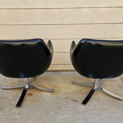 Pair of Mid Century Modern "Stowe & Davis" black leather & chrome swivel chairs. 
