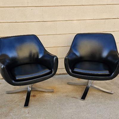 Pair of Mid Century Modern "Stowe & Davis" black leather & chrome swivel chairs. 