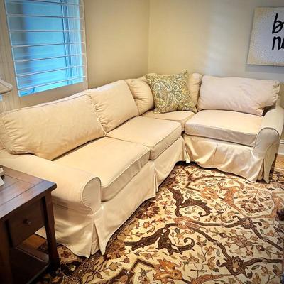 Pottery Barn slip-covered ivory sectional and Ralph Lauren Home oriental rug