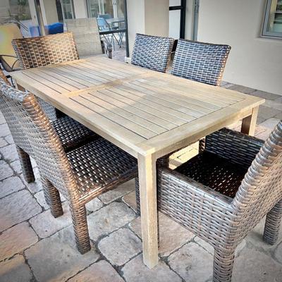 Teak dining table for 6, and six woven patio chairs