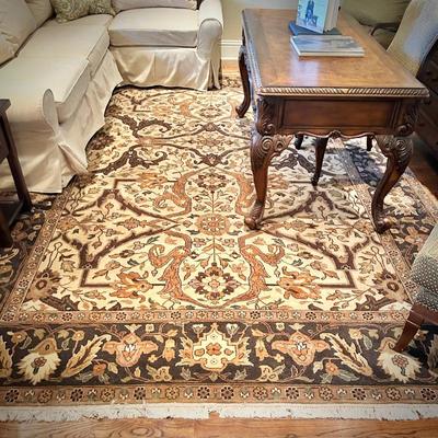 OrientPottery Barn slip-covered ivory sectional and Ralph Lauren Home oriental rugal rug