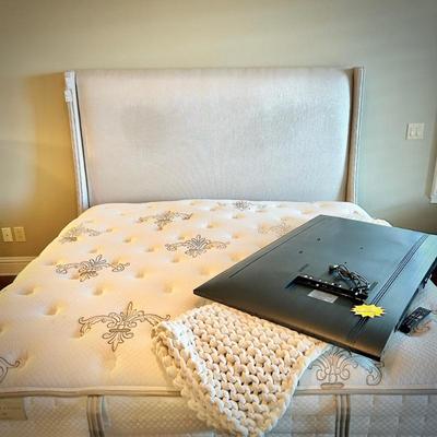 Stearns & Foster upholstered king bed with nailhead trim, and Stearns & Foster king mattress and box spring