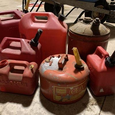 Lot 244 | Lot of Various Sized Metal & Plastic Gas Cans
