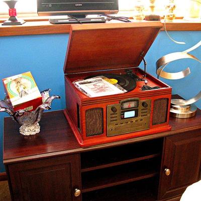 Musician 8-in-1 Record Player includes a cassette player, AM/FM radio, and a CD player with Bluetooth Function