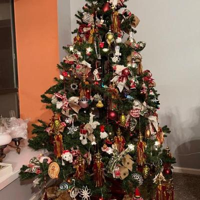 7ft Dougle Christmas Tree, full of vintage Christmas ornaments, new age ornaments and fully covered in boutique ribbons bows and lights 
