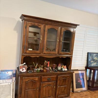 China cabinet, artwork, air filters, figurines, candle holders