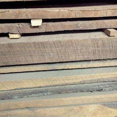 Seasoned and stacked walnut planks. Some 6" thick!