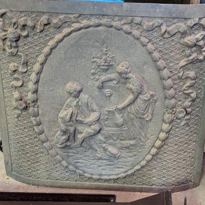 Antique cast iron fire back.