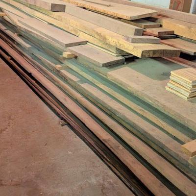 Seasoned and stacked walnut, cherry and various other woods
