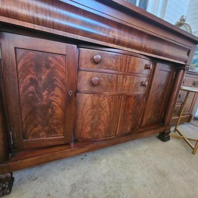 Antique Empire crotch mahogany sideboard