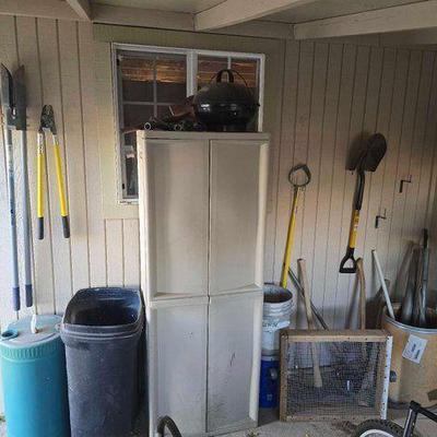 #2500 • Sterilite Storage Cabinet, Post Hole Digger, Shovels, Pick Axes, Trash Can

