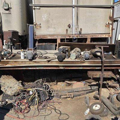 #2042 • 10' Work Bench with Littlestown Bench Vise, Leaf Springs, Paint Sprayer, Winch, Flywheels
