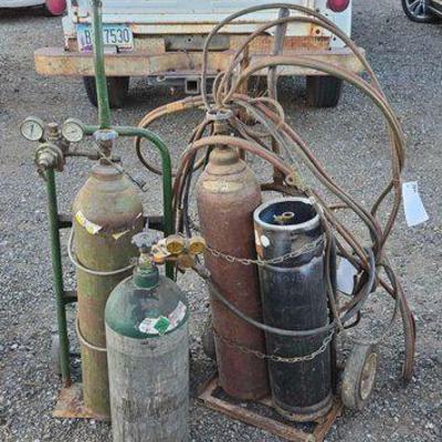 #80412 • (4) Metal Tanks, Gauges, Welding Wire, Hoses & Dolly
