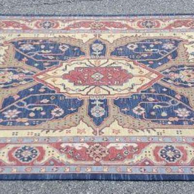 Red area rug accented in blues