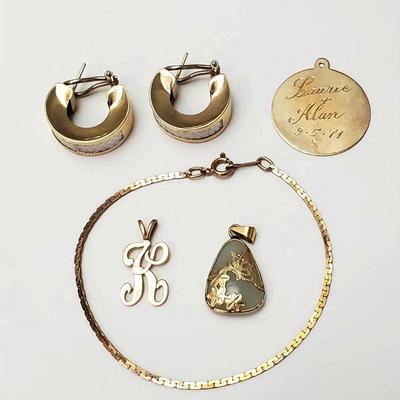 14k gold bracelet and charms