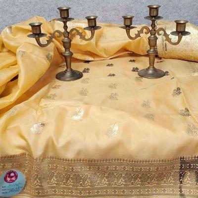 Hand woven silk and gold indian textile and brass candelabras
