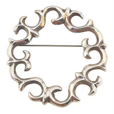 Lot 121   
Vintage Sand Cast Silver Circle Brooch