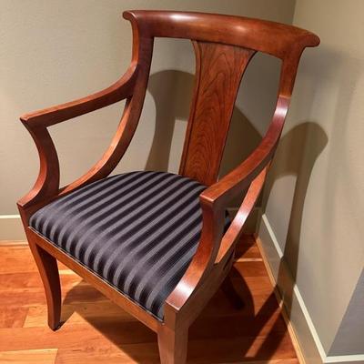 One of 2 dining table arm chairs by Stickley